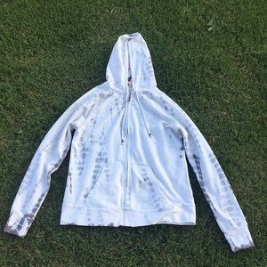 A light sweater with pockets and hood.